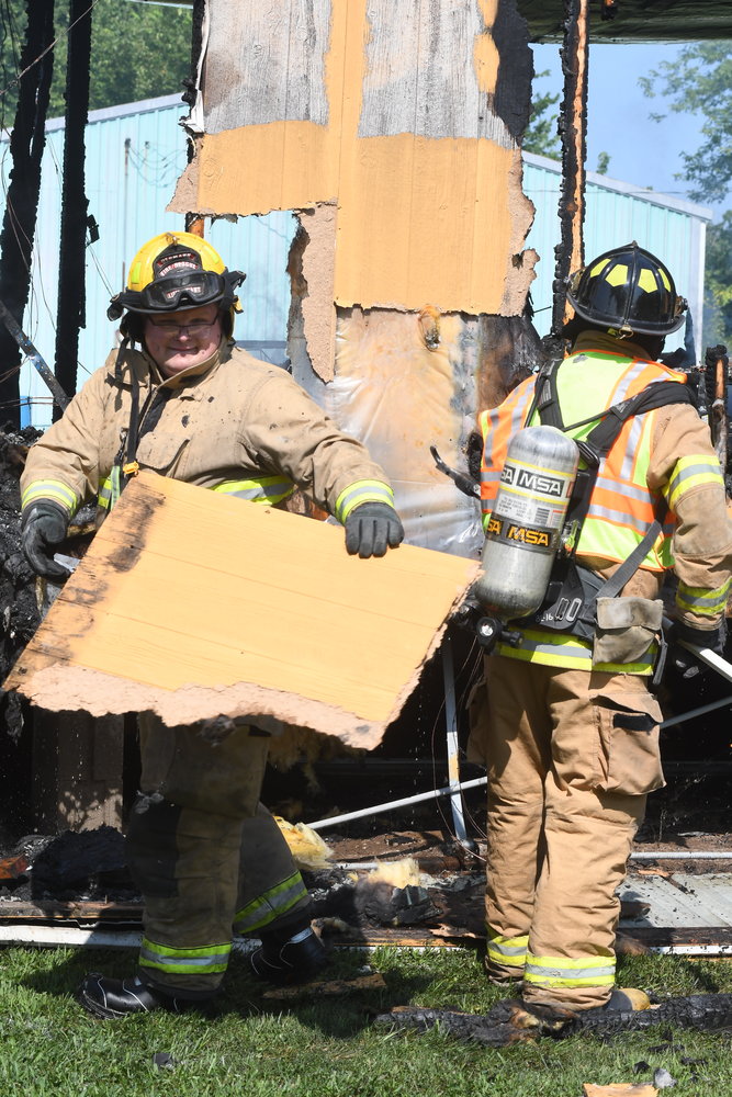 Owensville firemen were assisted by Hermann Fire Department personnel with extinguishing an August mobile home fire caused by a suspected squatter burning a candle for light.