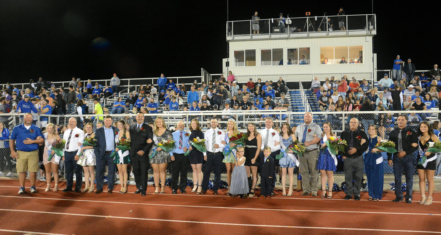 Homecoming court members and their fathers gathering for a group photograph included (from left) Jason Witthaus and Kennedie Witthaus, Bill Bader and Macy Bader, Rich Winkelmann and Quin Winkelmann,  Jayson Hollrah and Allyson Hollrah, Tim Schutt and Malerie Schutt, Ryan Miller and Morgan Miller (queen), junior attendants Bethany Mueller and Calvin Miller with retiring queen Zoe Schafer, Craig Hemeyer and  Kampbell Hemeyer, Luke Groner and Reese Groner, Todd Sunfield
and Haley Sunfield, and Shawn Lane and Karigan Lane. The host Bearcats prevailed for a 36-35 come-from-behind win over Owensville to reclaim the Gasconade County Bowl trophy which will remain in Hermann until the schools meet again in football in 2022. Owensville athletic director  Ryan Okenfuss presented the trophy.