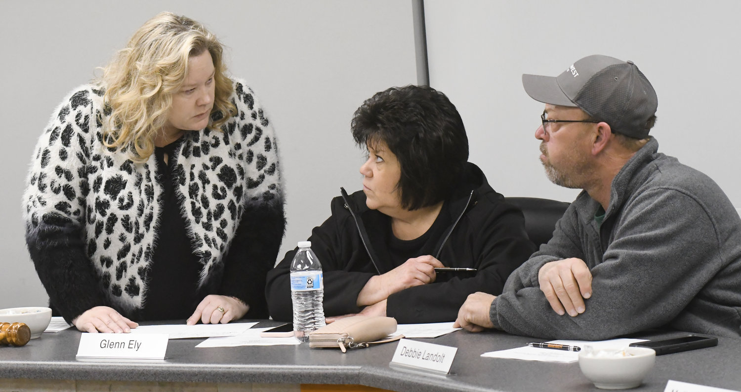 R-2 Superintendent Dr. Jeri Kay Hardy (left) goes over a list of capital projects on Monday during a Long Range Facility Committee meeting with Board of Education member Debbie Landolt and Gary Pohlmann, the district’s transportation director.
