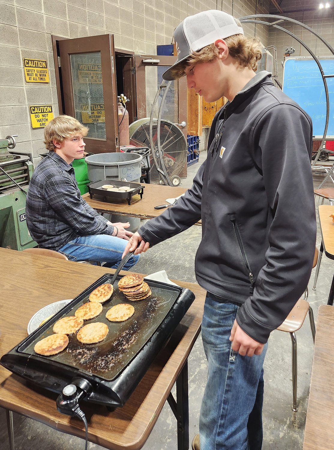 Jaden Gerlemann and Luke Reed handled sausage and pancake duties.