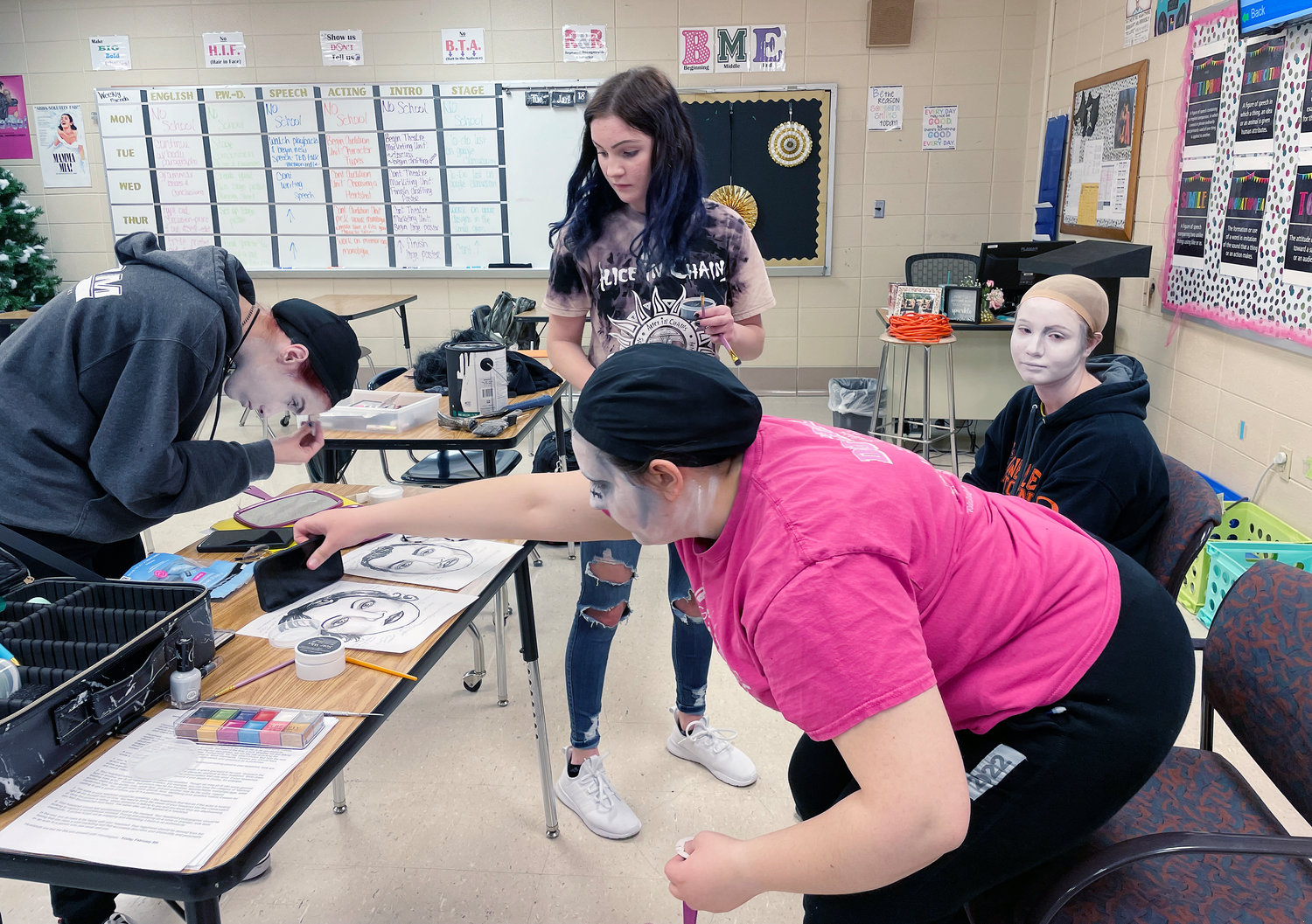 Fellow drama club students assisted Peyton Lairmore with her costume and make-up presentation during Missouri State Thespian Conference in Kansas City.