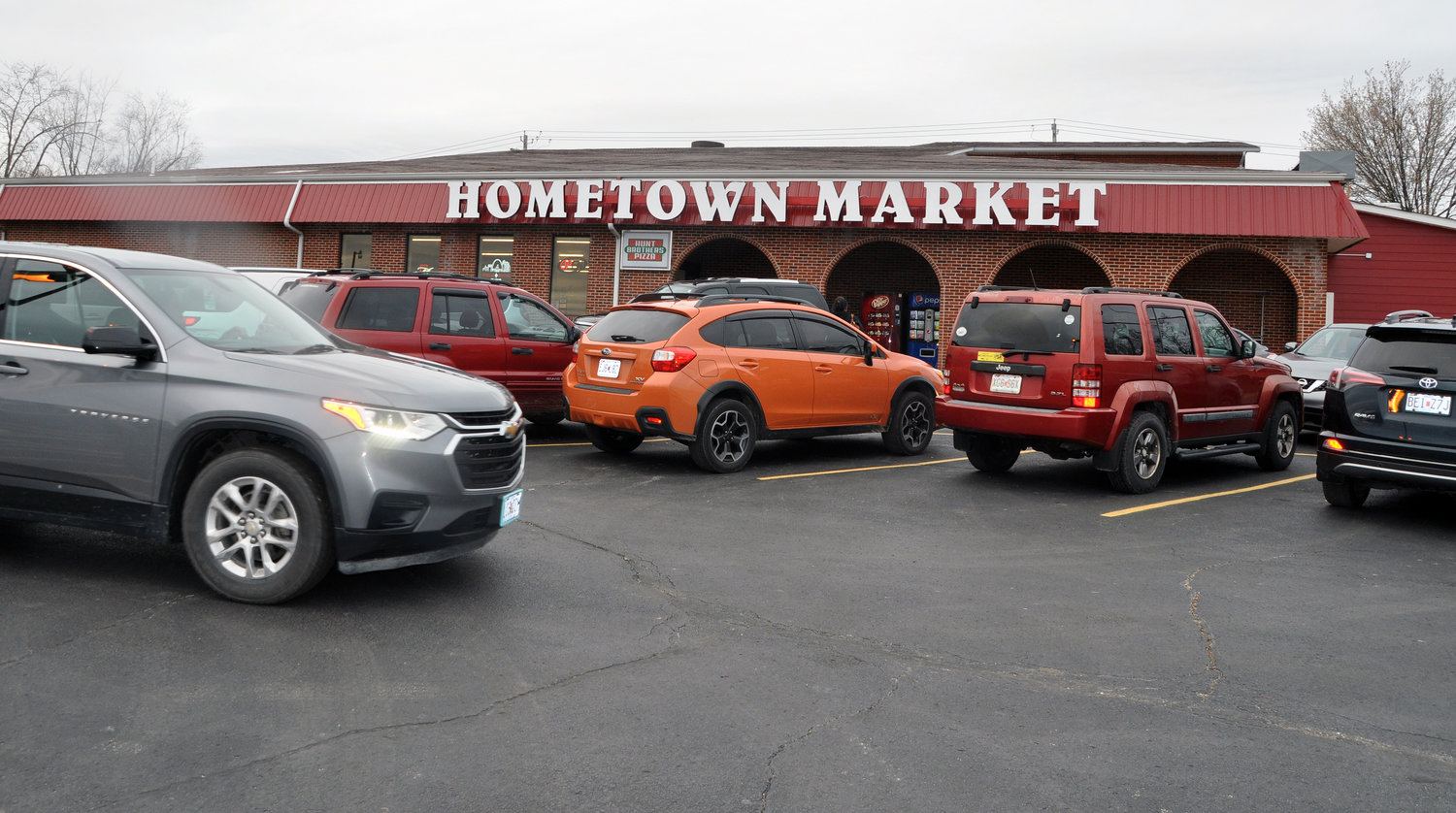 The parking lot was just as crowded as the store as vehicles cruised the lot waiting for an open spot.