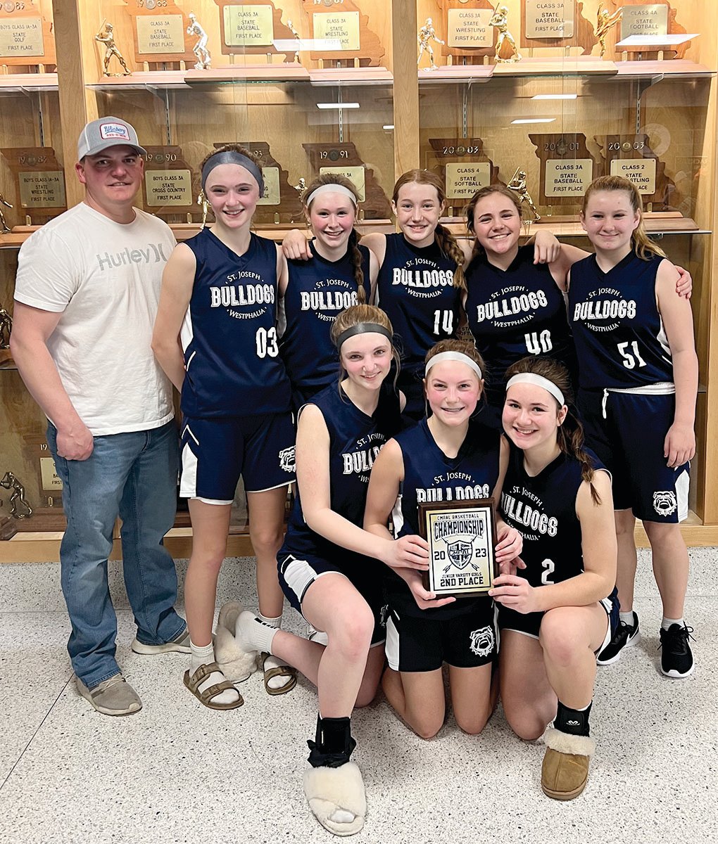 Members of the second-place St. Joseph JV blue girls’ team are, from left to right, front row, Addison Lehmen, Brie Massman, and Marlee Oliver; and in the back row, Coach Jake Massman, Addison Bower, Cali Kampeter, Casey Kleffner, Macie Rademan, and Renee Wilbers.