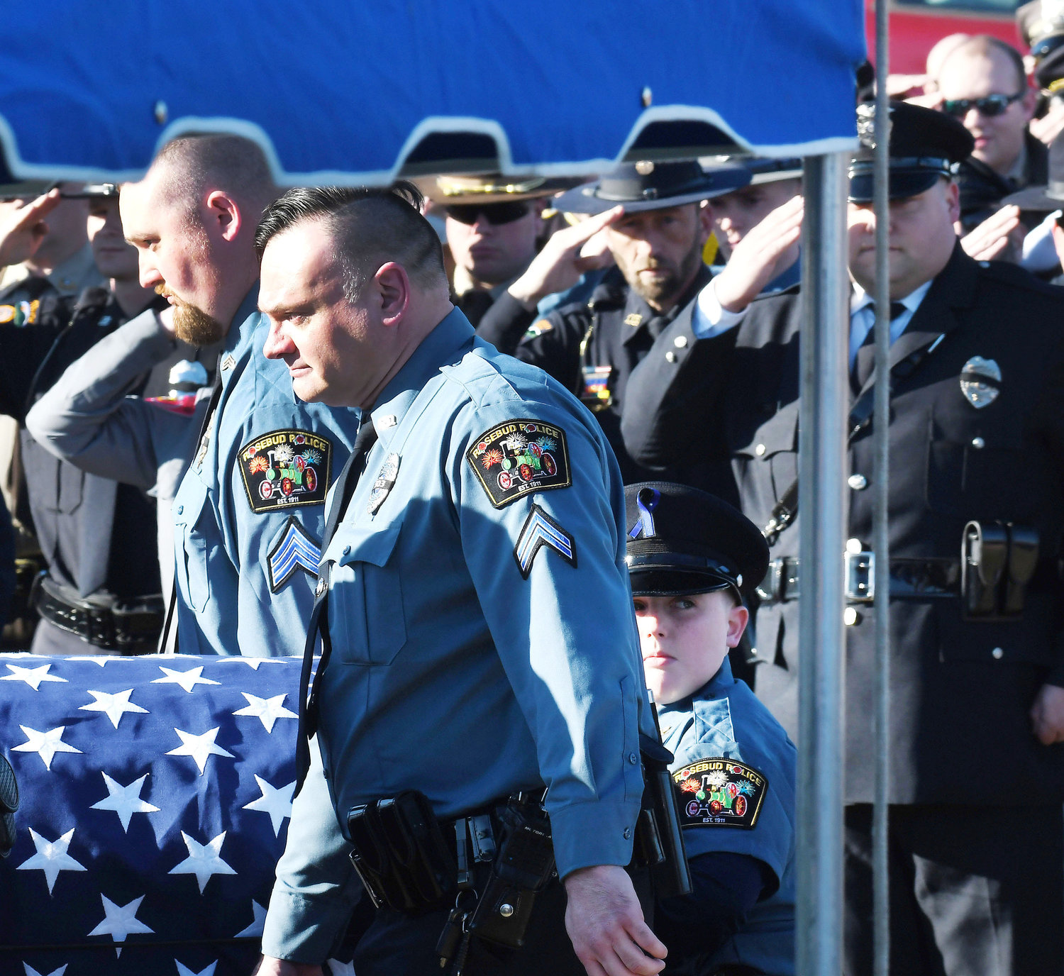 Griffith’s son, Karson helps carry his father’s casket with Rosebud Police Cpl. Ryan McCrary (foreground) and Sgt. Lynde Mantels.