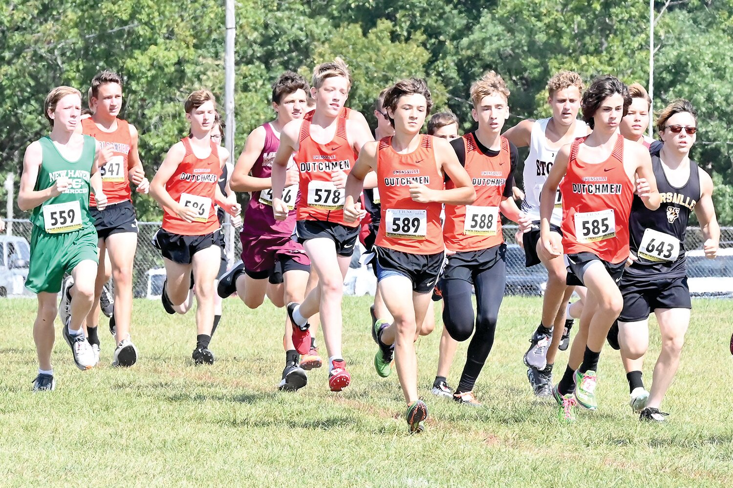 OHS JV Dutchmen cross country runners stay together in a pack from the start of the JV Boys race at the 45th Annual Linn Cross Country Invitational late Saturday morning at the Osage County Fairgrounds in Linn.