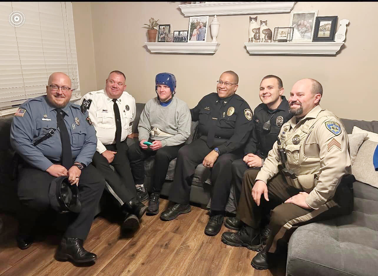 He is pictured at his home with fellow law enforcement officers including Alexander Lambright with Hermann police, Gasconade County Sheriff Scott Eiler, Hermann Police Chief Marlon Walker, Josh Krull, a reserve officer for several agencies and 911 director in Osage County, and Franklin County Sheriff’s Sgt. Jerod Blankenship.
